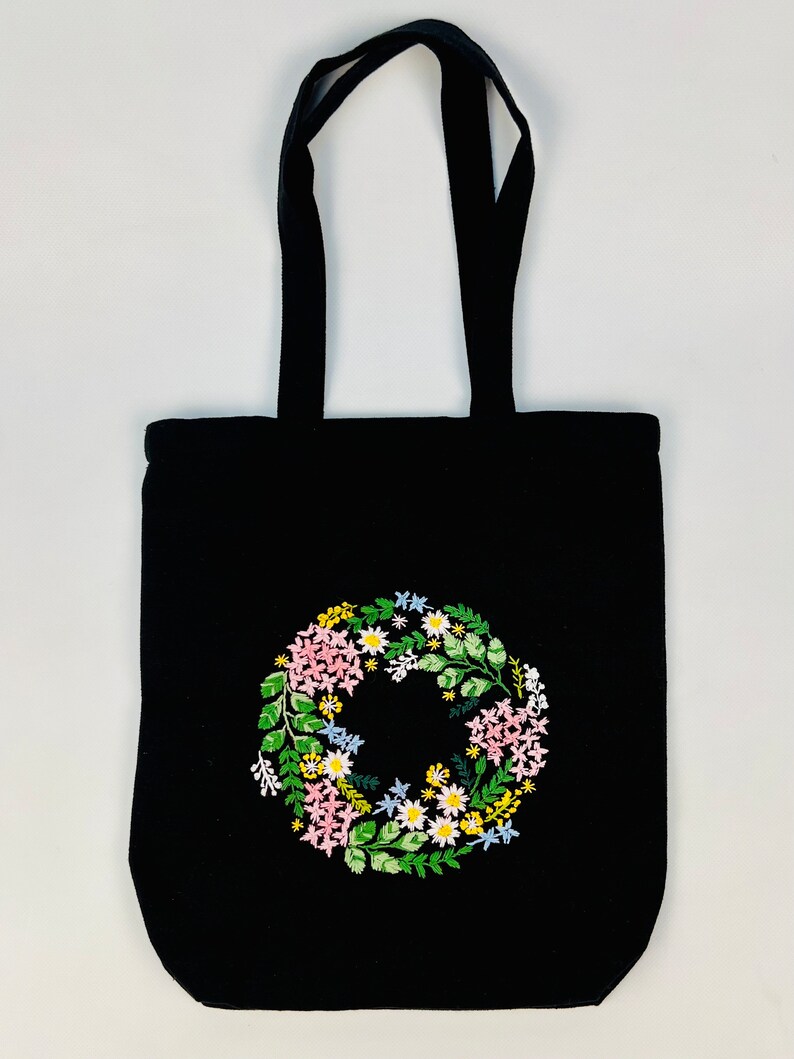 Handmade black tote bag with floral embroidery