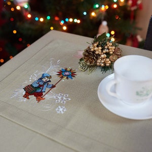 Festive beige cotton napkin with holiday winter scenes