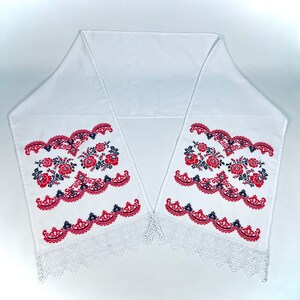 Handmade embroidered towel with red rose motifs and lace trim