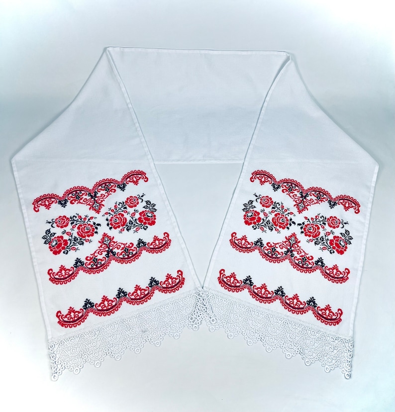 Handmade embroidered towel with red rose motifs and lace trim