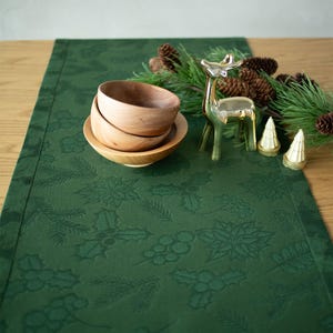 Dark green Christmas table runner with holly and pine pattern, Elegant holiday table decoration for winter dining room or festive party