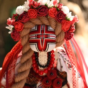 Handmade Ukrainian Motanka doll with embroidered face and traditional wreath, Collectible doll art, Unique decorative gift image 9