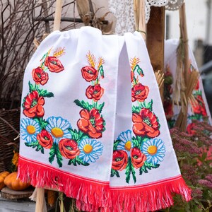 Hand-embroidered table runner with vibrant floral design