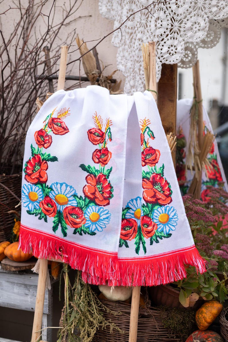 Hand-embroidered table runner with vibrant floral design