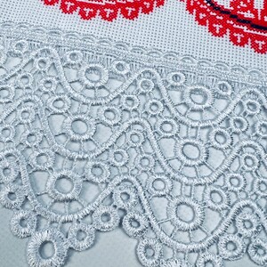 Handmade embroidered towel with red rose motifs and lace trim