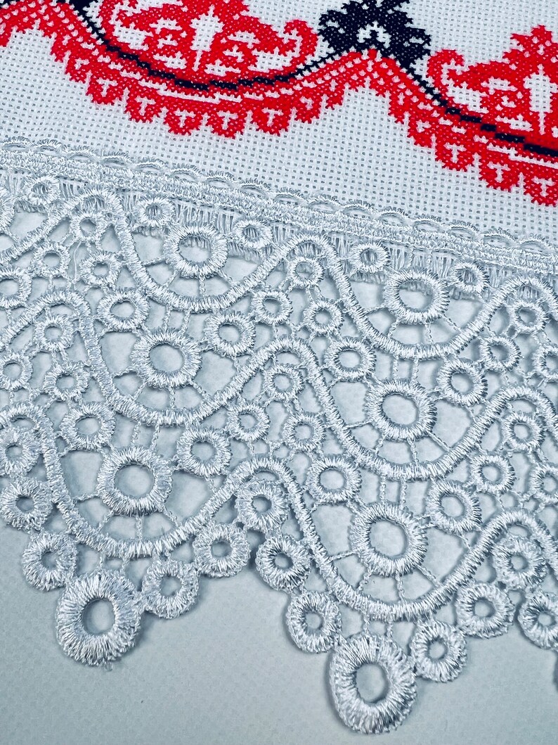 Handmade embroidered towel with red rose motifs and lace trim
