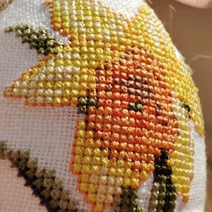 Easter daffodil embroidered hanging egg ornament with cross stitch design