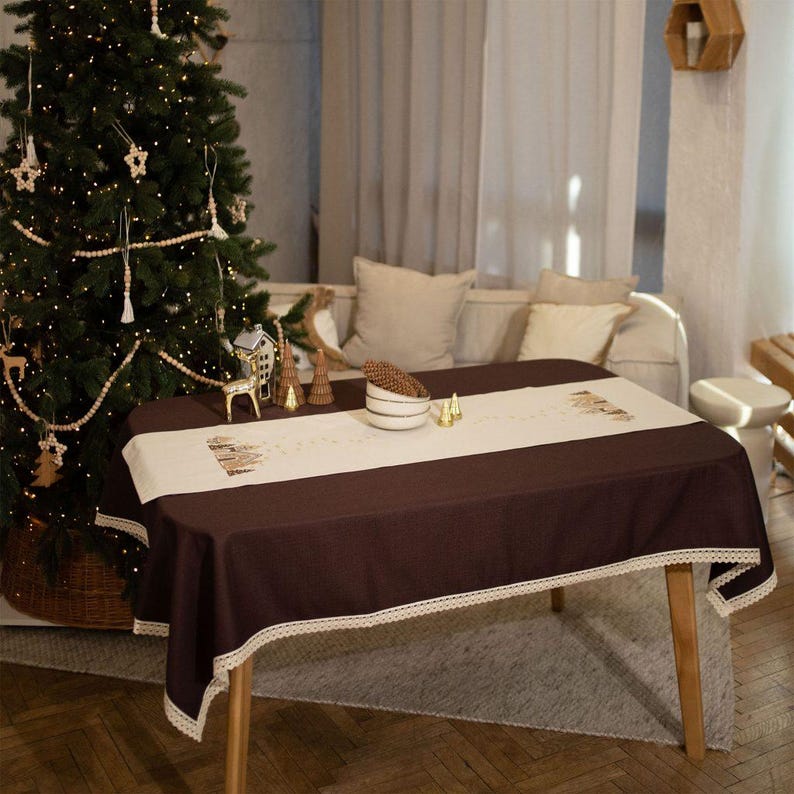 Christmas table runner with embroidered gingerbread house design