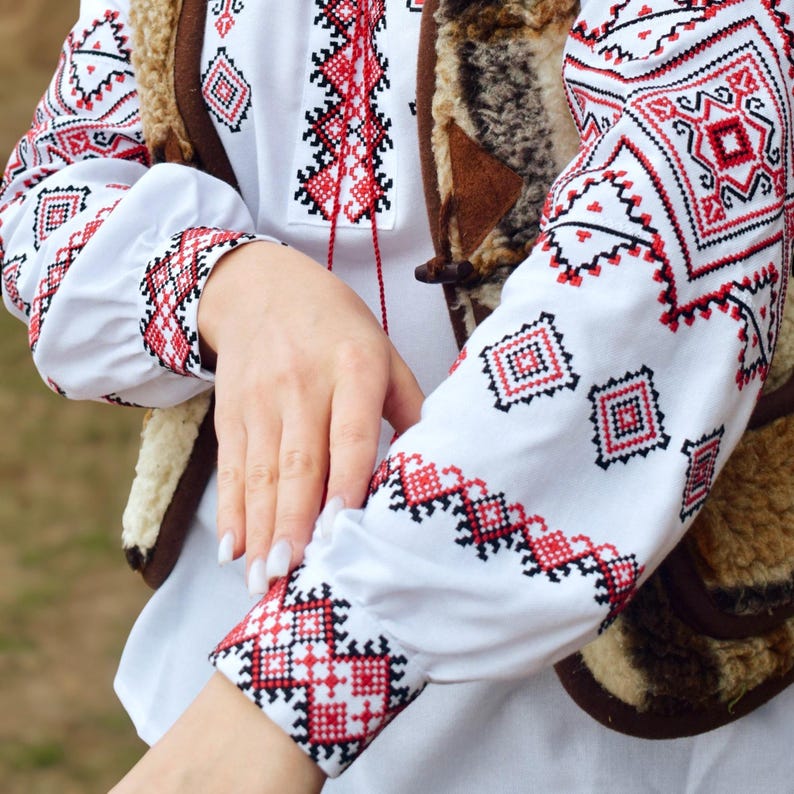 White Folk Embroidered Blouse with Red and Black Geometric Patterns – Long Sleeve Traditional Peasant Shirt for Women with Tassel Tie Detail