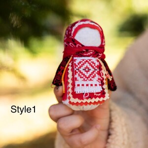 Traditional cloth doll in yellow with floral embroidery