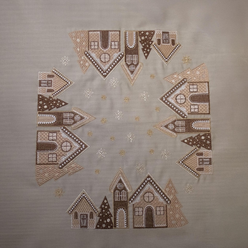 Christmas table napkin with embroidered gingerbread house design