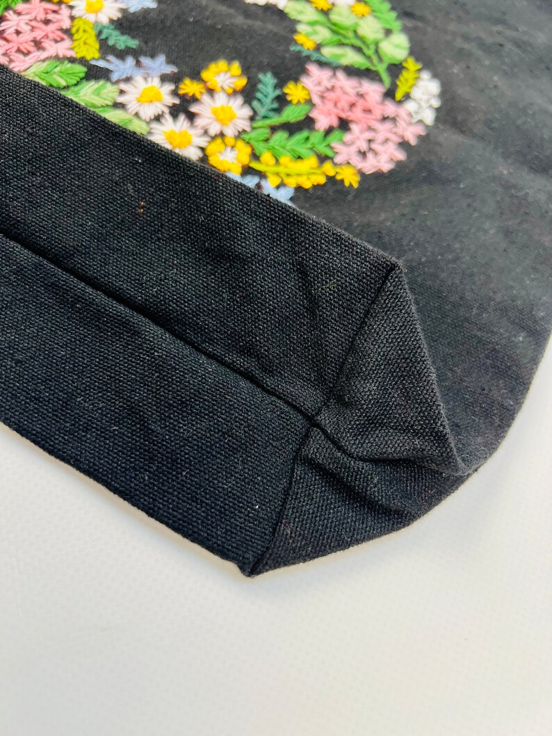Handmade black tote bag with floral embroidery