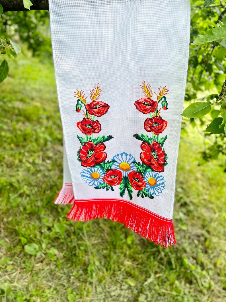 Hand-embroidered table runner with vibrant floral design