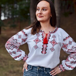 White Folk Embroidered Blouse with Red and Black Geometric Patterns – Long Sleeve Traditional Peasant Shirt for Women with Tassel Tie Detail