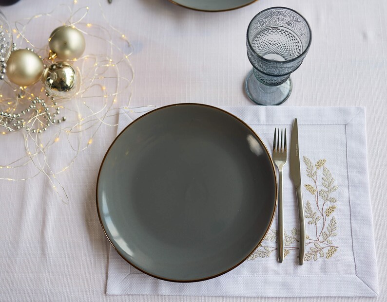 Embroidered white placemats set