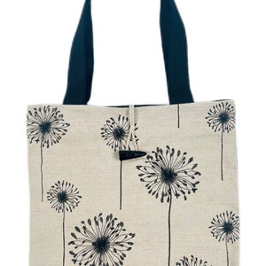 Linen tote bag with black dandelion print and wooden button