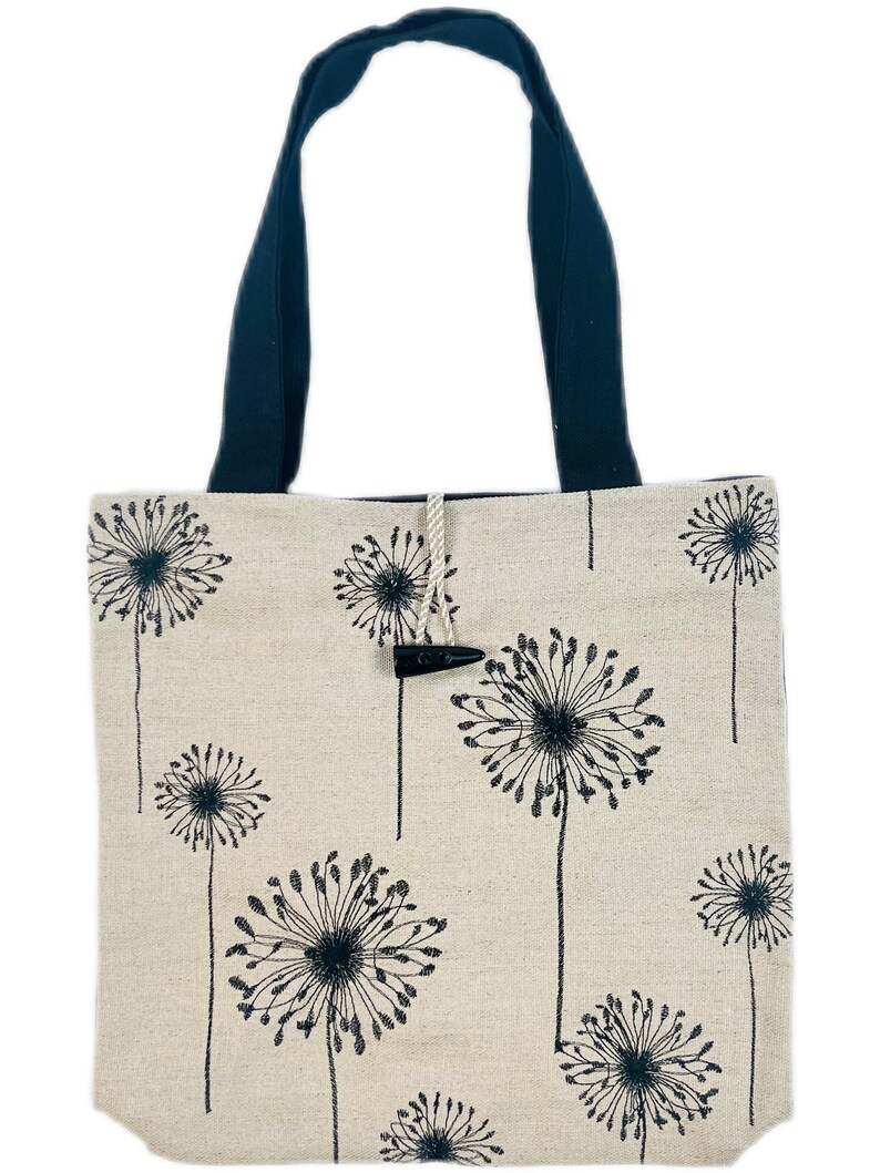 Linen tote bag with black dandelion print and wooden button