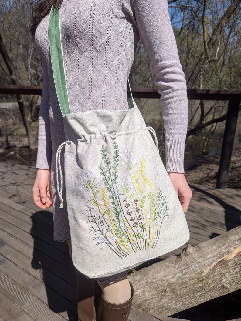 Handwoven blue drawstring bag with geometric embroidery, Boho crossbody bag, Ethnic-inspired backpack with adjustable straps image 7