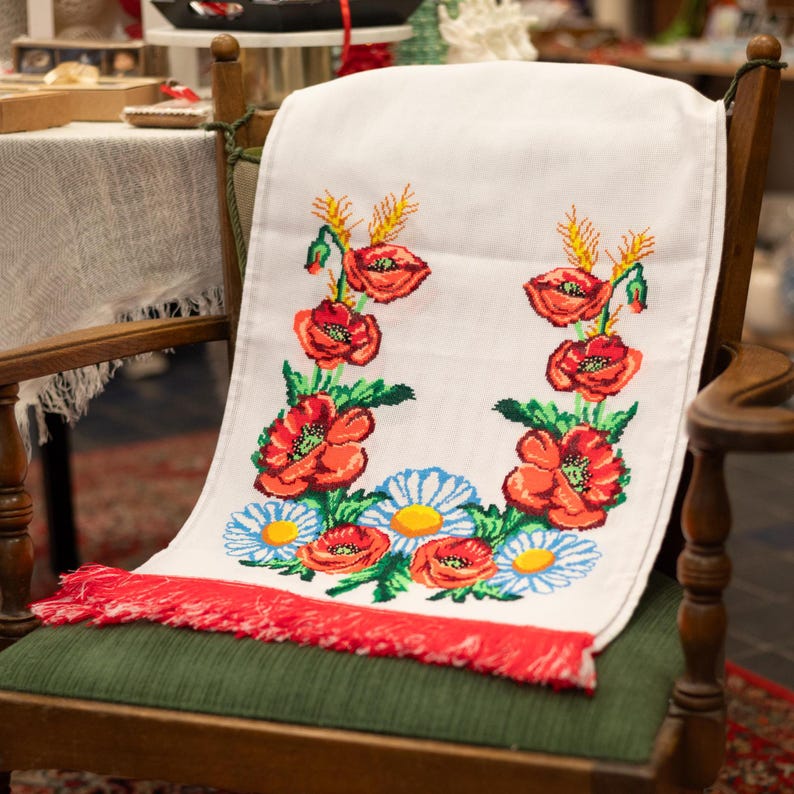 Hand-embroidered table runner with vibrant floral design