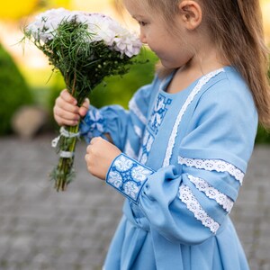 Traditional blue embroidered Ukrainian girl dress with long sleeves and white lace trim, Folk style cotton outfit for special occasions
