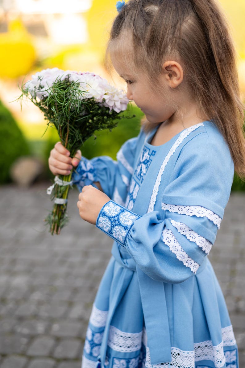 Traditional blue embroidered Ukrainian girl dress with long sleeves and white lace trim, Folk style cotton outfit for special occasions