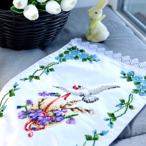 Beaded cover with bird
