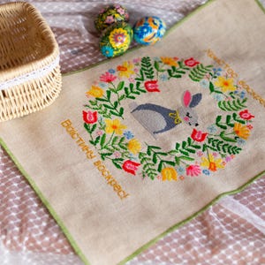 Handmade embroidered Easter basket cover with bunny and floral wreath design