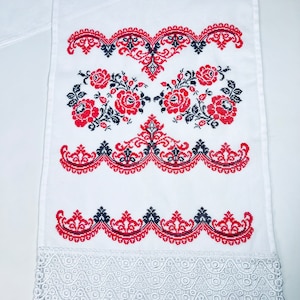 Handmade embroidered towel with red rose motifs and lace trim
