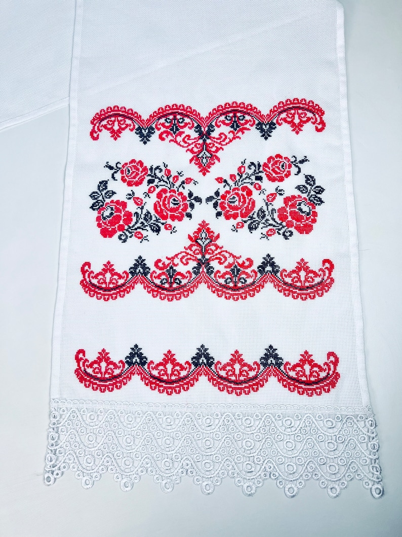 Handmade embroidered towel with red rose motifs and lace trim