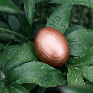 Elegant wooden decorative eggs in gift box for spring holiday table or Christian decor