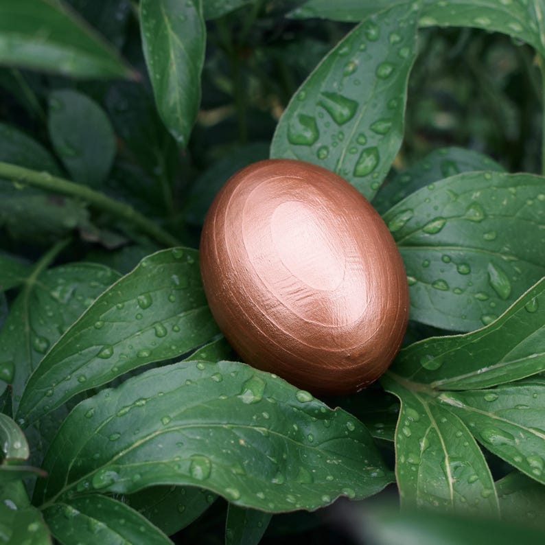 Elegant wooden decorative eggs in gift box for spring holiday table or Christian decor