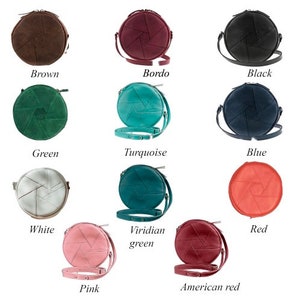 May include: A collection of round, crossbody bags in various colors, including brown, bordeaux, black, green, turquoise, blue, white, viridian green, pink, American red, and red. Each bag features a unique geometric design and a matching strap. The names of the colors are written below each bag.