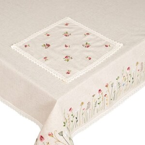 May include: A white linen tablecloth with a delicate floral embroidery design. The tablecloth features a square insert with a smaller floral pattern and a border of delicate lace.