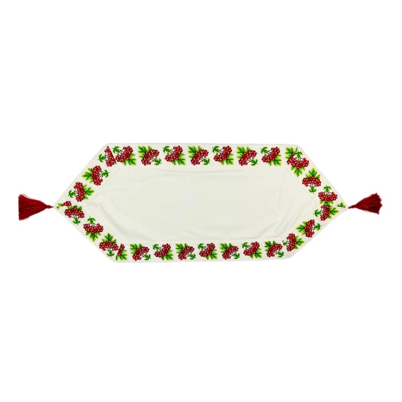 May include: Cream-colored table runner with a detailed embroidered border of red berries and green leaves. The runner has burgundy tassels at each end. A decorative textile for the dining room or kitchen.