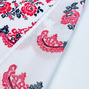 Handmade embroidered towel with red rose motifs and lace trim