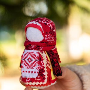 Traditional cloth doll in yellow with floral embroidery
