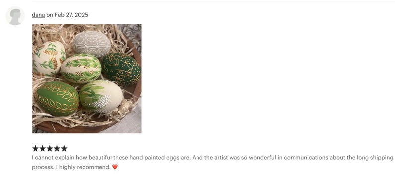 May include: A collection of six hand-painted decorative eggs in a wooden bowl filled with straw. The eggs feature various designs, including floral patterns and gold accents, in shades of green, white, and gold. The eggs are a unique Easter or home decor item.
