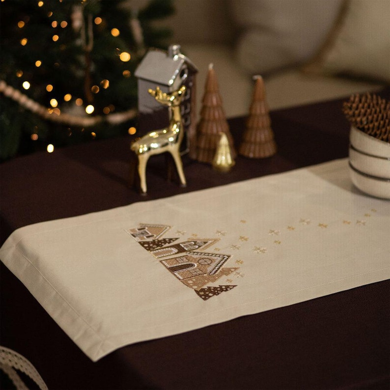 Christmas table runner with embroidered gingerbread house design