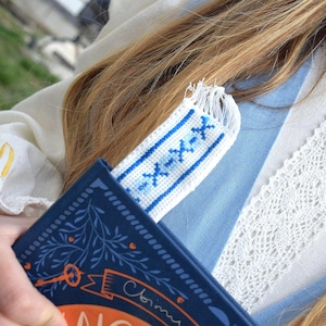 Embroidered fabric bookmark with blue cross stitch