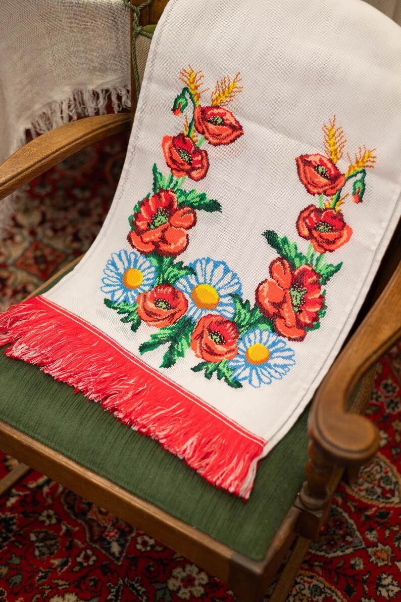 Hand-embroidered table runner with vibrant floral design