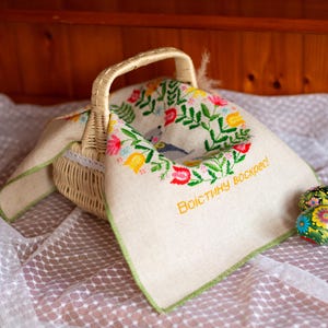 Handmade embroidered Easter basket cover with bunny and floral wreath design