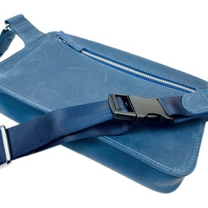 Stylish blue leather cross body bag with adjustable strap