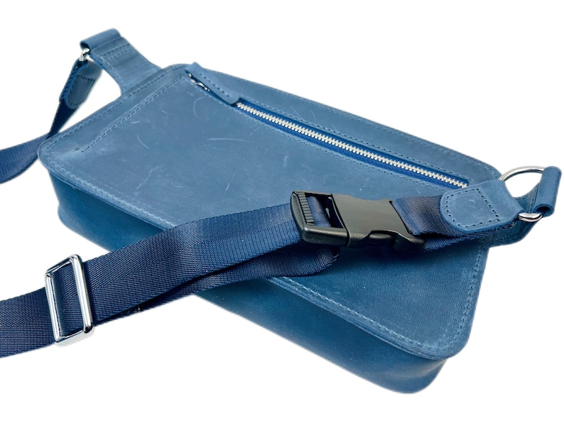 Stylish blue leather cross body bag with adjustable strap