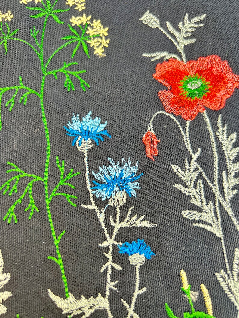 Black canvas tote with embroidered wildflowers, poppies and cornflowers, reusable cotton shoulder bag for shopping, books, market and gifts