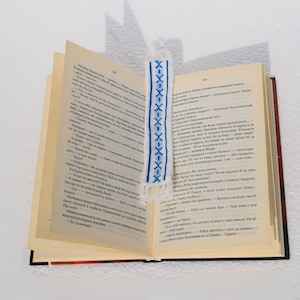 Embroidered fabric bookmark with blue cross stitch