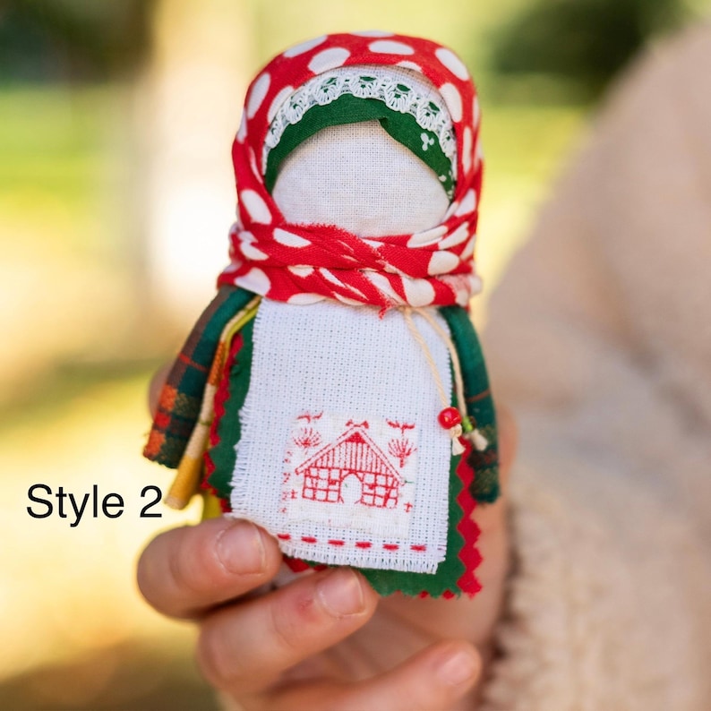 Traditional cloth doll in yellow with floral embroidery