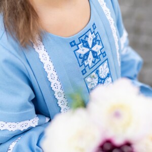 Traditional blue embroidered Ukrainian girl dress with long sleeves and white lace trim, Folk style cotton outfit for special occasions