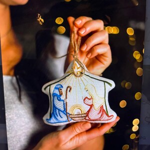 Nativity scene linen Christmas ornament with embroidered mary Joseph and Baby Jesus – Religious holiday tree decoration with star detail