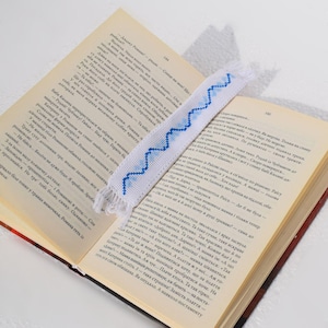 Embroidered fabric bookmark with blue cross stitch