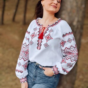 White Folk Embroidered Blouse with Red and Black Geometric Patterns – Long Sleeve Traditional Peasant Shirt for Women with Tassel Tie Detail